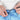 Person adjusting the drawstrings on blue tie-dye shorts.