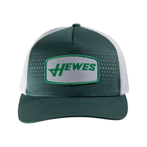 Front of a green and white trucker hat with a mesh back and a patch that reads 'HEWES'.