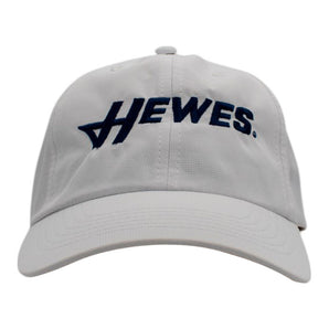 White baseball cap with a navy 'HEWES' logo embroidered across the front. 
