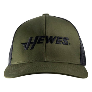 Front of an olive green baseball cap with a black hewes logo.